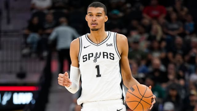 Oct 13, 2023; San Antonio, Texas, USA; San Antonio Spurs center Victor Wembanyama (1) dribbles the ball up court during the first half against the Miami Heat at Frost Bank Center.